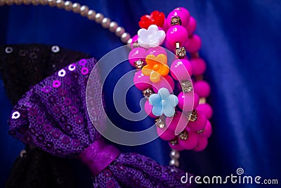 Beautiful and colourful hair clips, bracelet for kids and teens on a blue background Stock Photo