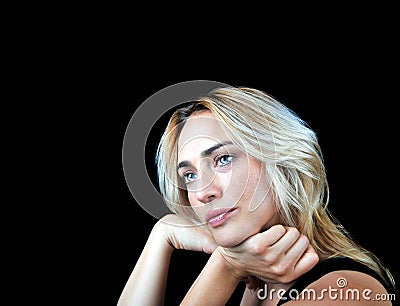 Beautiful compassionate woman on black background. Stock Photo