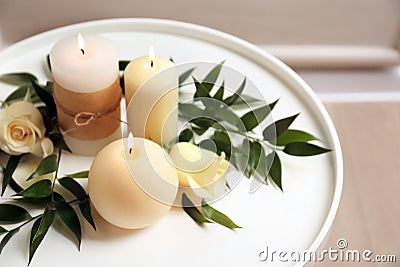 Beautiful composition with burning candles and flowers Stock Photo