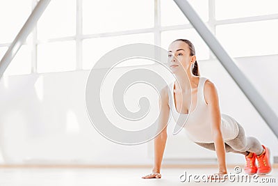 Beautiful concentrated woman doing push ups Stock Photo