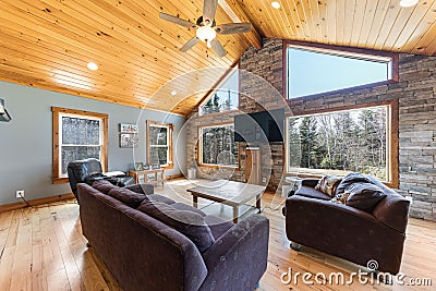 Beautiful contemporary rustic cabin interior living room design with a wooden ceiling Editorial Stock Photo