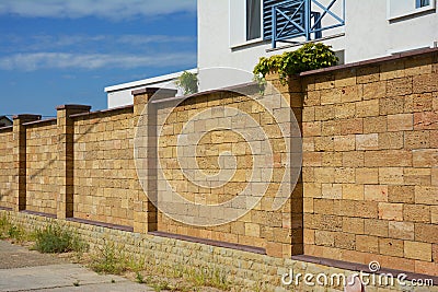 Beautiful Coquina, Shelly Limestone Fence Wall. Natural Stone F Stock Photo