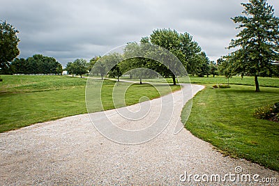 Beautiful country lane leading to farm, on a stormy summer day in Illinois Stock Photo