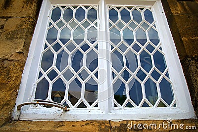 Window in the cotswolds. old white metal frame Stock Photo