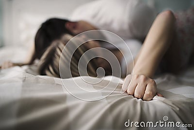 Beautiful couple being romantic and passionate in bed Stock Photo