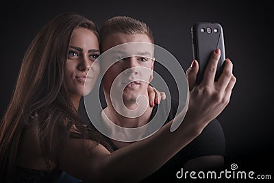 Beautiful couple with mobile phone Stock Photo