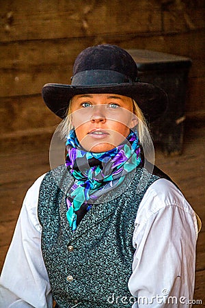 Beautiful Cowgirl in Western Scene Stock Photo