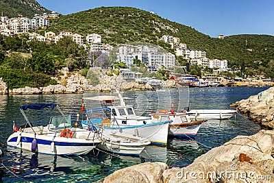 Beautiful cozy resort town on the sea with moored boats on the shore Stock Photo