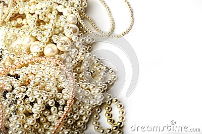 Beautiful cream pearl necklaces on a white background Stock Photo