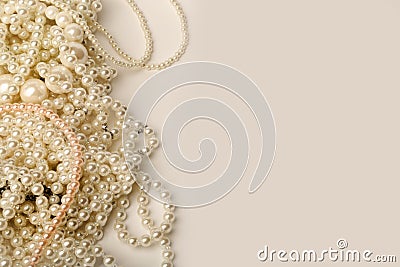 Beautiful cream wedding pearl necklaces on a grey background Stock Photo