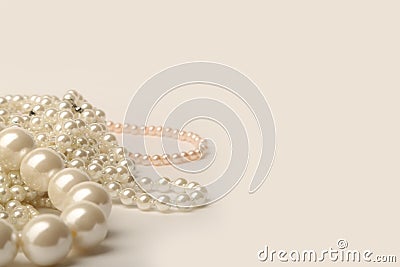 Beautiful cream wedding pearl necklaces on a white background Stock Photo