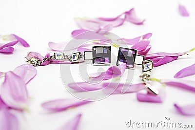 Beautiful crystal earings with lila petals Stock Photo