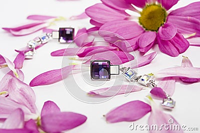 Beautiful crystal earings with lila petals Stock Photo
