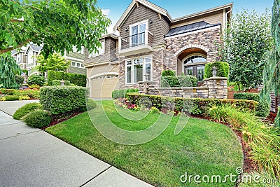 Beautiful curb appeal of American house with stone trim Stock Photo