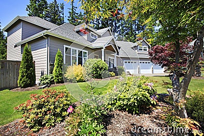 Beautiful curb appeal of classic American home with nice landscape design. Stock Photo