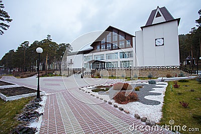 Beautiful curb appeal of a classic holiday home in Siberia with a beautiful front yard landscaping. Image of landscaping. Stock Photo