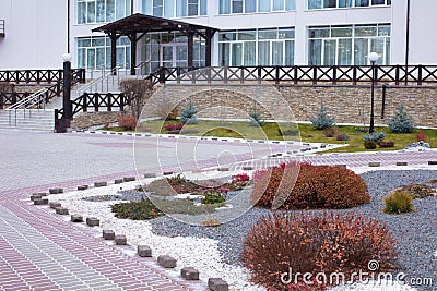 Beautiful curb appeal of a classic holiday home in Siberia with a beautiful front yard landscaping. Image of landscaping. Stock Photo