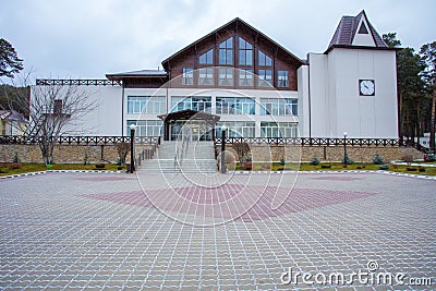 Beautiful curb appeal of a classic holiday home in Siberia with a beautiful front yard landscaping. Image of landscaping. Stock Photo