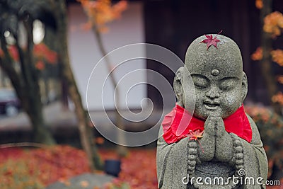 Janapese shrine cute calm praying buddha stone crafting Stock Photo