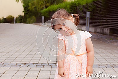 Beautiful cute little girl with sad face Stock Photo