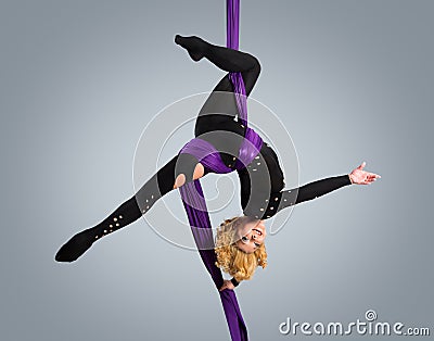 Beautiful dancer on aerial silk, aerial contortion, aerial ribbons, aerial silks, aerial tissues, fabric, ribbon Stock Photo
