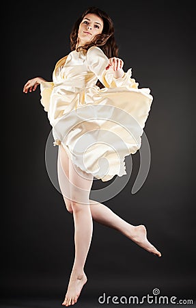Beautiful dancer jumping on dark Stock Photo