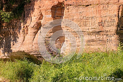 Beautiful day on the river, sandstone cliffs and tree reflections in the water, blue sky reflected in the river water Stock Photo