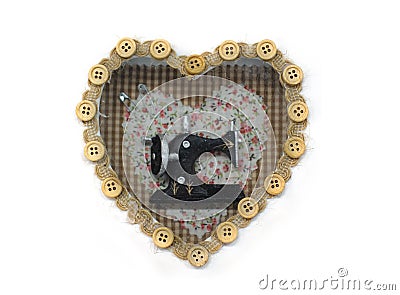 Beautiful decor in the form of heart with a sewing machine insid Stock Photo