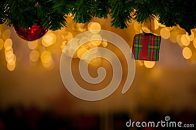 Beautiful decorated Christmas tree background with red gift box and xmas ornaments Stock Photo