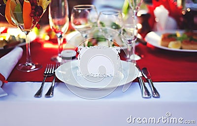 Beautiful decorated place at the table with the guest card on holiday, empty copy space Stock Photo