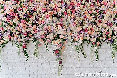 Beautiful Decorative Colorful Roses on Brick Wall Stock Photo