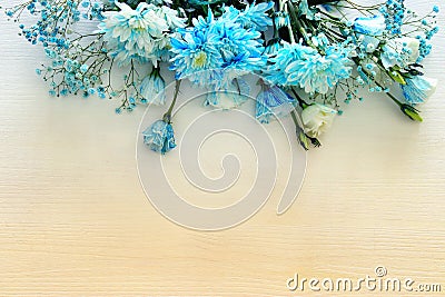 beautiful and delicate blue flowers arrangement on white wooden background Stock Photo
