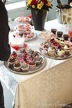 Beautiful delicious cakes. confectionery curry at a festive party. many sweet muffins on a tray Stock Photo