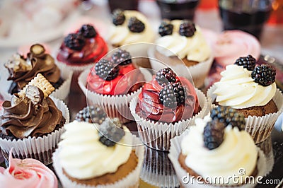 Beautiful delicious cakes. confectionery curry at a festive party. many sweet muffins on a tray Stock Photo