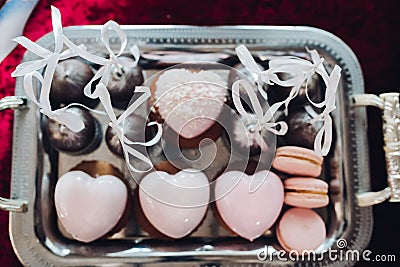 Beautiful delicious heart shaped cakes, pink color. Stock Photo