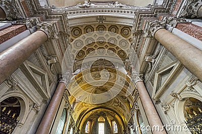 Beautiful detail of ceiling and marble columns of basilica of St Stock Photo