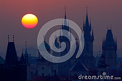 Beautiful detailed sunrise view of Prague church towers. Early morning colours with old town. Twilight in historical city. Magica Stock Photo