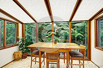 Beautiful dining area with transparant glass wall Stock Photo