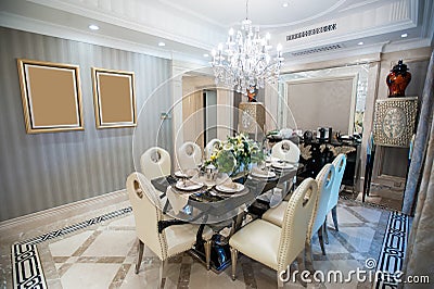 Beautiful dining room with Chandelier in a mansion Stock Photo