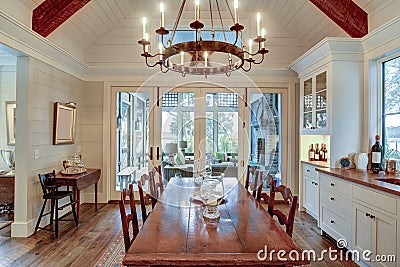 Beautiful diningroom with view onto porch and waterfront property Stock Photo