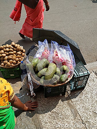 Beautiful Dragon Fruit, Kiwi and Guyabano or soursop fruit selling on wooden basket on roadside Stock Photo
