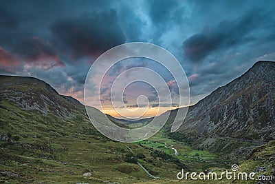 Beautiful dramatic landscape image of Nant Francon valley in Snowdonia during sunset in Autumn Stock Photo