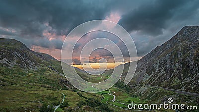 Beautiful dramatic landscape image of Nant Francon valley in Snowdonia during sunset in Autumn Stock Photo