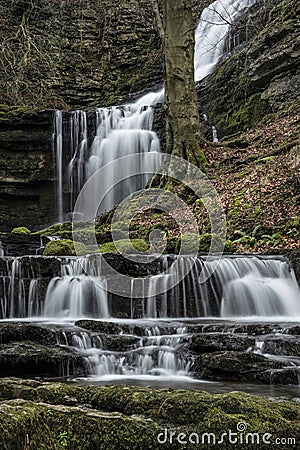 Beautiful dramatic landscape image of Scaleber Force waterfall in Yorkshire Dales in England during Winter morning Stock Photo