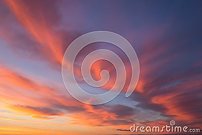 Beautiful dramatic sunrise blue sky with orange colored clouds Stock Photo