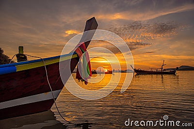 Beautiful dramatic sunrise at Rawai beach with andaman long tail Editorial Stock Photo