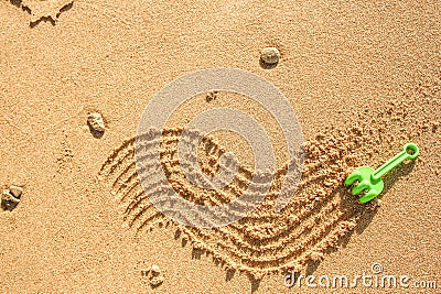 Beautiful drawing on the sand of the sea background Stock Photo
