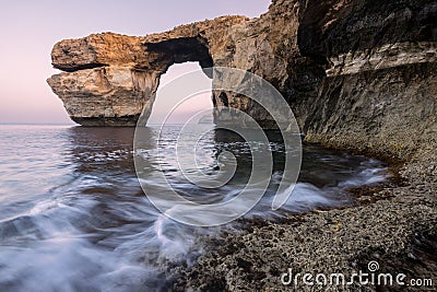 A beautiful early morning landscape photograph of the famous Azure Window rock arch Stock Photo