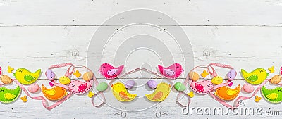 Beautiful Easter background with traditional decor. Flowers, decorative eggs, birds and rabbits Stock Photo