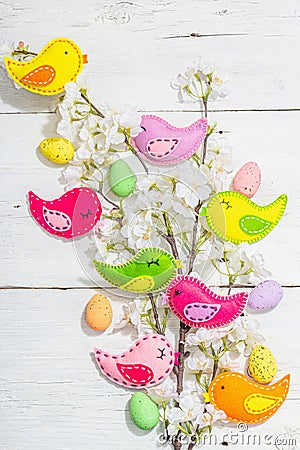 Beautiful Easter background with traditional decor. Flowers, decorative eggs, birds and rabbits Stock Photo